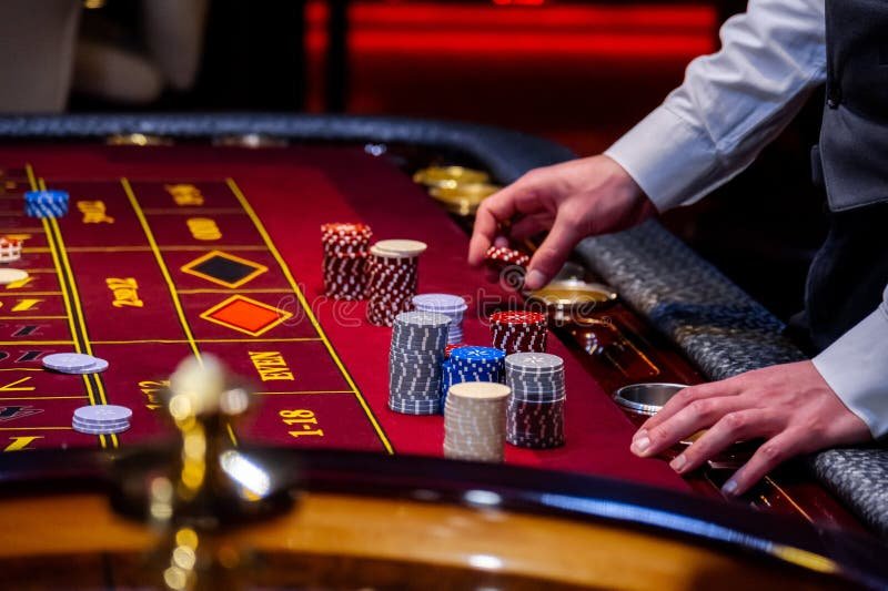 Live casino dealer streaming baccarat table in real time